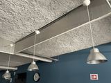 three lights hanging from the ceiling in a room