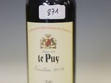 a bottle of wine that is sitting on a table