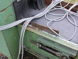 a green oven that has a bunch of wires in it