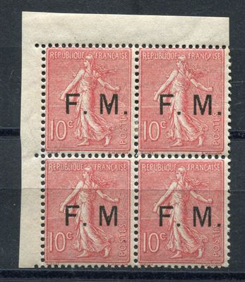 four stamps with a woman on them on a black surface