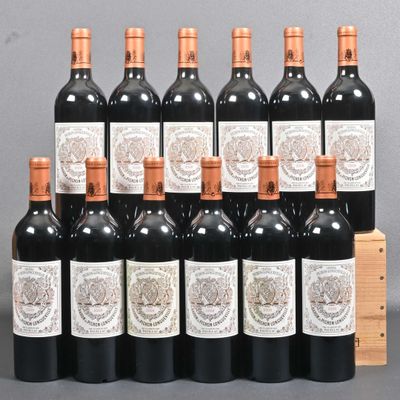 several bottles of red wine are lined up in a row