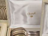 a box with silverware in it that is sitting on a table