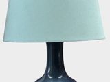 a blue table lamp with a blue shade on it