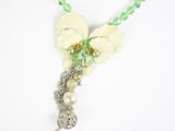 green and white flower necklace with pearls and crystal beads