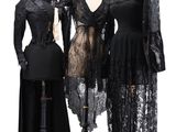 three dresses on a mannequin stand and a dress on a mannequin stand