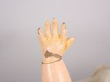 a hand that has a ring on it that is on a mannequin