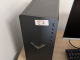 a desktop computer sitting on top of a desk next to a keyboard and mouse