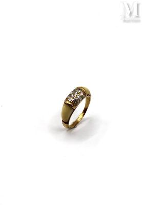 a close up of a gold ring with diamonds on a white background