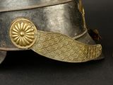 a close up of a helmet on a black surface
