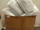 a cardboard box full of pillows and pillows on a pallet