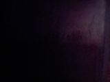 night time photo of a street light in a dark city