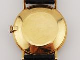an image of a close up of a watch on a white surface