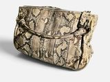 the snake skin purse is on a white surface