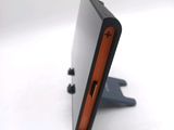 a cell phone that is sitting on top of a stand