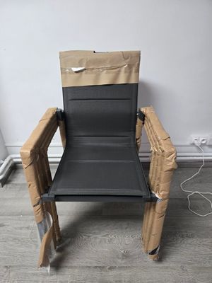 a chair made out of cardboard sitting on the floor
