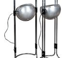 pair of chrome table lamps with chrome lampshads on stands