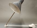 a lamp that is on top of a metal pole