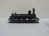 a black train on a white surface with a white background