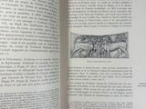 an open book with a drawing of a man riding a horse
