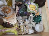a wooden box filled with assorted glass items
