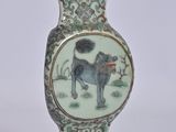 a vase with a picture of a horse and a dog on it