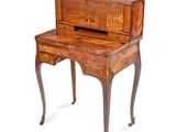 a small desk with a drawer on top of it