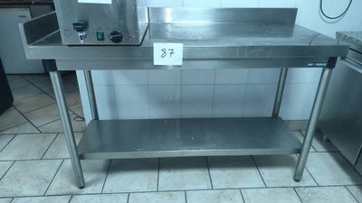 a stainless steel table with a microwave on it