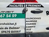 a white van that has stickers on the side of it