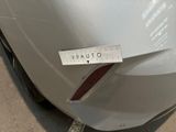 a close up of a sticker on a car ' s rear bumper