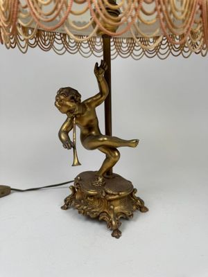 an image of a lamp that is on a table with a lamp shade