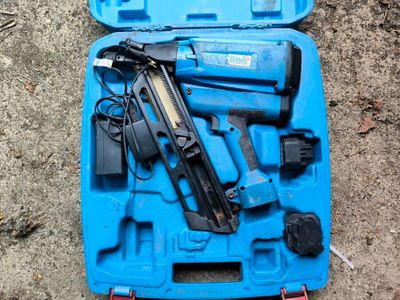 a blue tool case with a stapler and a stapler in it