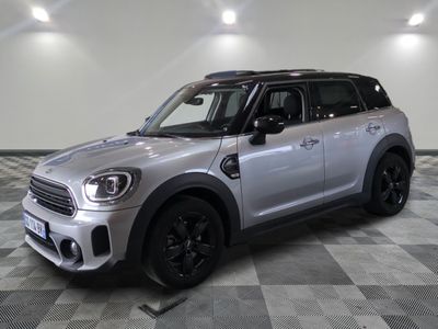 the mini countryman is parked on a checkered tile floor