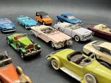 a lot of toy cars that are sitting on a table