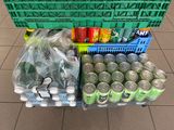 many cans of soda and cans of soda on a cart