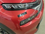 a close up of the front of a red car