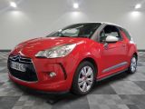 the red citrole is parked in the garage on a checkered floor
