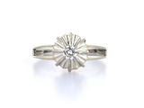 a close up of a diamond ring on a white background