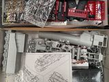 a box full of toy trains and other toy vehicles