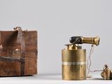 a small wooden box with a camera and some other items
