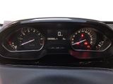 a close up of a car dashboard with a speedometer and gauges