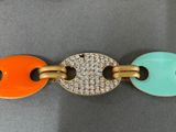 a close up of a bracelet with two circles on it
