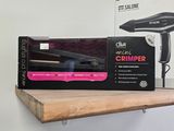 a box of hair dryer sitting on a shelf next to a box of hair dryers