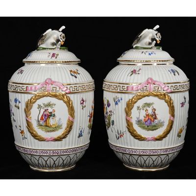 pair of vases decorated with a horse and a man on a horse