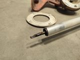 a pipe that is sitting on the ground next to a pipe