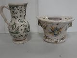 two vases sitting next to each other on a table