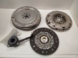 two clutch plates and a flywheel on a white table