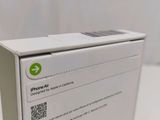 an apple air box sitting on top of a table with a qr code on it
