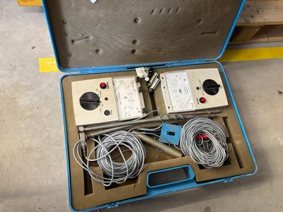 a box with wires and wires in it on the floor