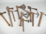 several different types of axes are arranged on a white surface