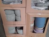 two boxes that have yarn in them on a pallet
